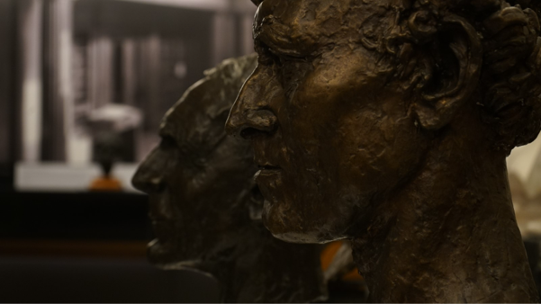 close-up of two busts in bronze viewed side-on
